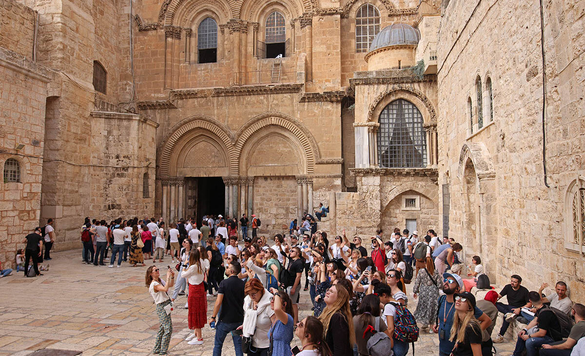 Tourists visit the Church of the Holy Sepulchre in the Old City of Jerusalem. (Getty)