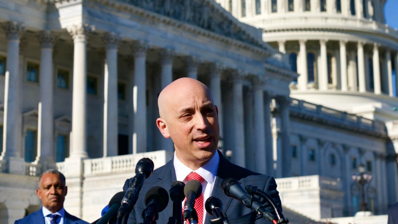 ADL CEO Jonathan Greenblatt, at podium, joining District of Columbia Attorney General Karl Racine, at left, in filing a lawsuit against the groups that allegedly organized the insurrection at the Capitol, speaks at a press conference at the U.S. Capitol, Dec. 14, 2021. (Ralph Alswang)