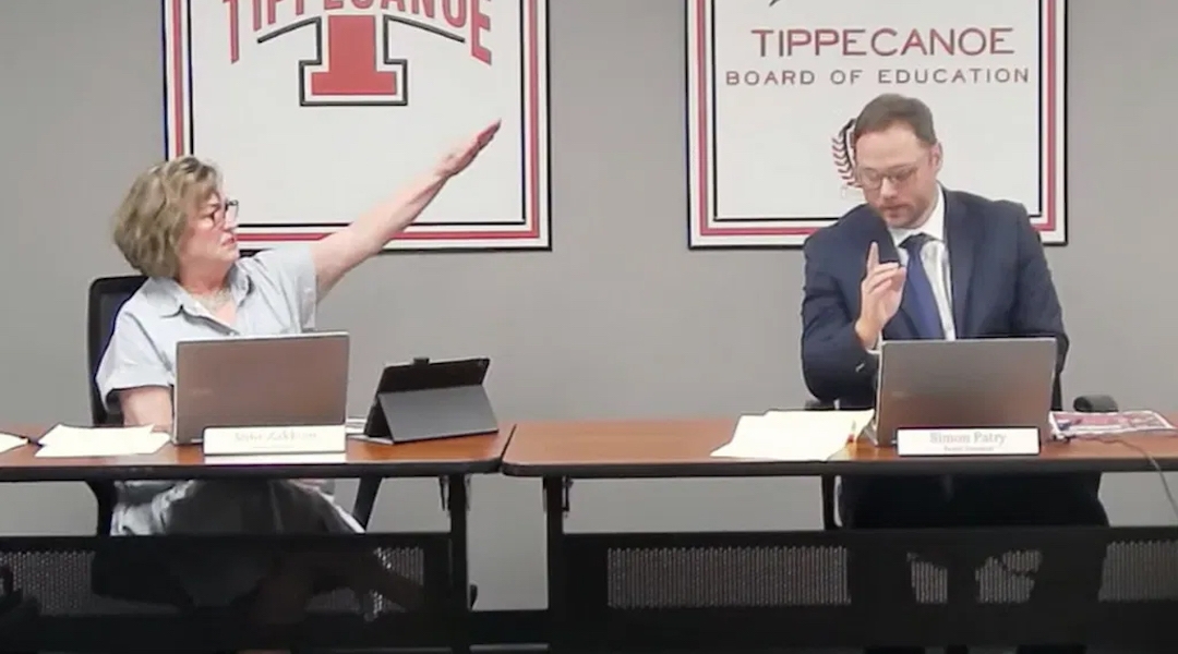 Tipp City Board of Education member Anne Zakkour delivers a Nazi salute and utters “Sieg Heil” at board then-president Simon Patry during a public meeting, Sept. 5, 2023. (Screenshot via Tipp City Board of Education)