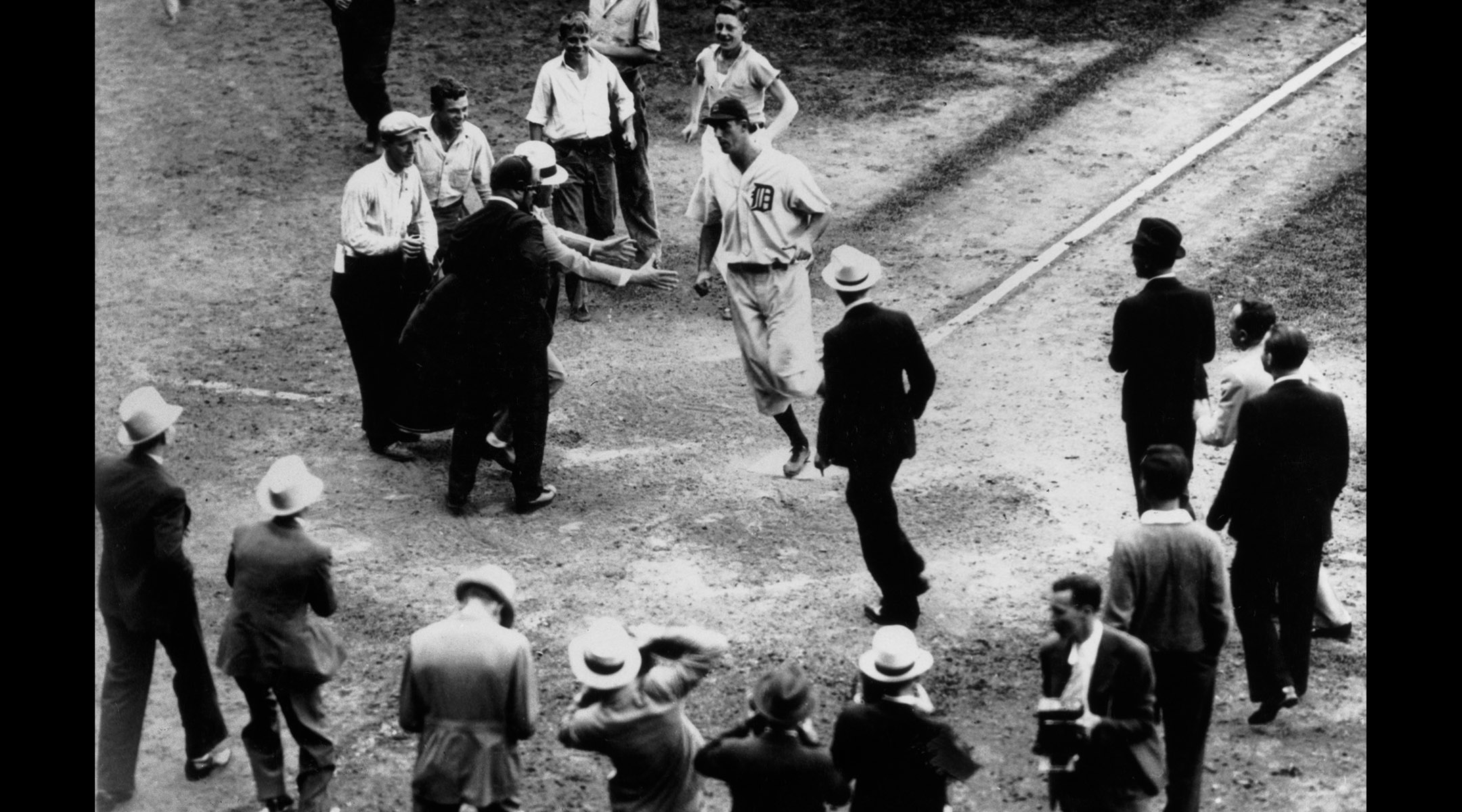 Hank Greenberg scores after hitting a home run to give the Detroit Tigers a 2-1 victory over the Boston Red Sox, Sept. 10, 1934. (UPI/Bettmann Archive/Getty Images)