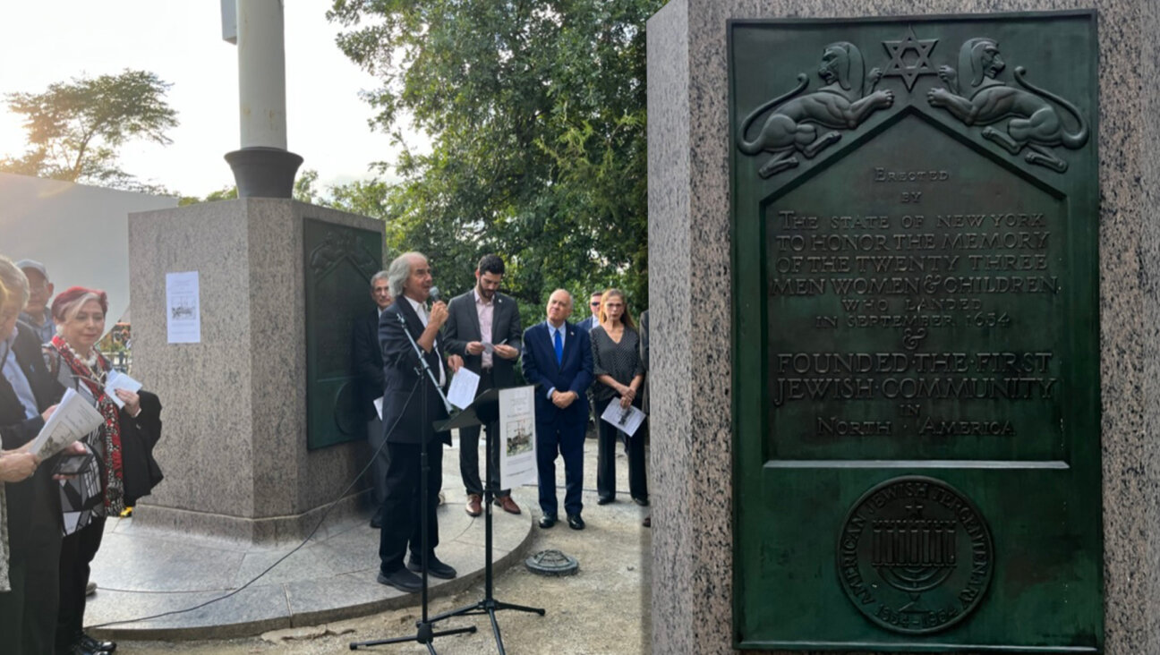 Howard Teich speaks at a monument in The Battery that marks the Jewish arrival in New York in September 1954. (Julia Gergely)