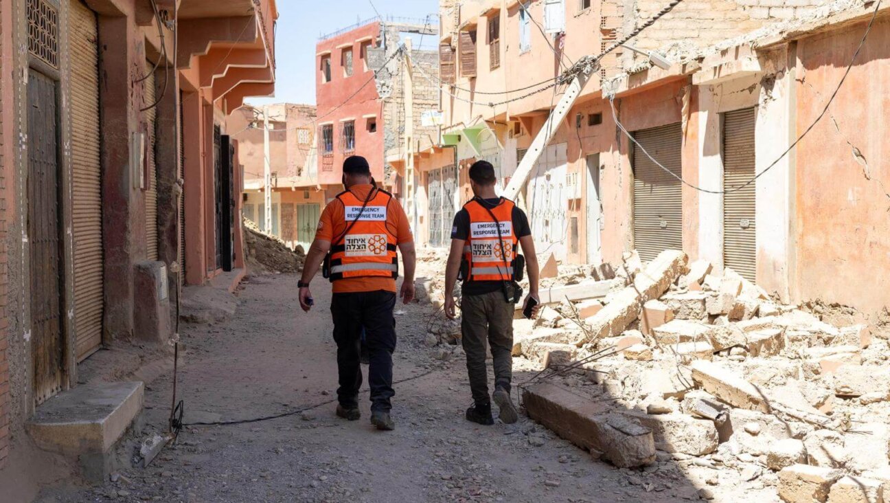 The author (right) and United Hatzalah teammatae Erez Gollan walk through a hard hit area in the village of Amizmiz, Morocco, Sept. 10, 2023.