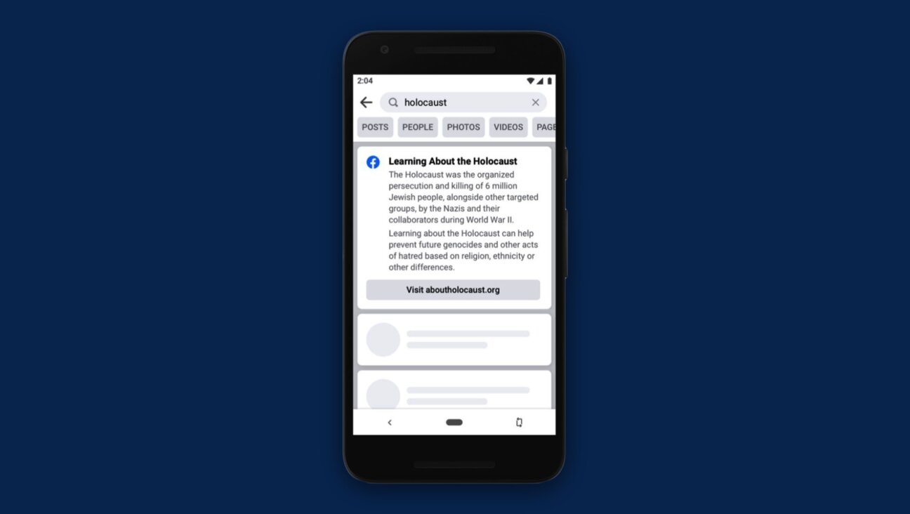 A view of the notification Facebook announced in 2021 that it would use to combat Holocaust denial. (Facebook)