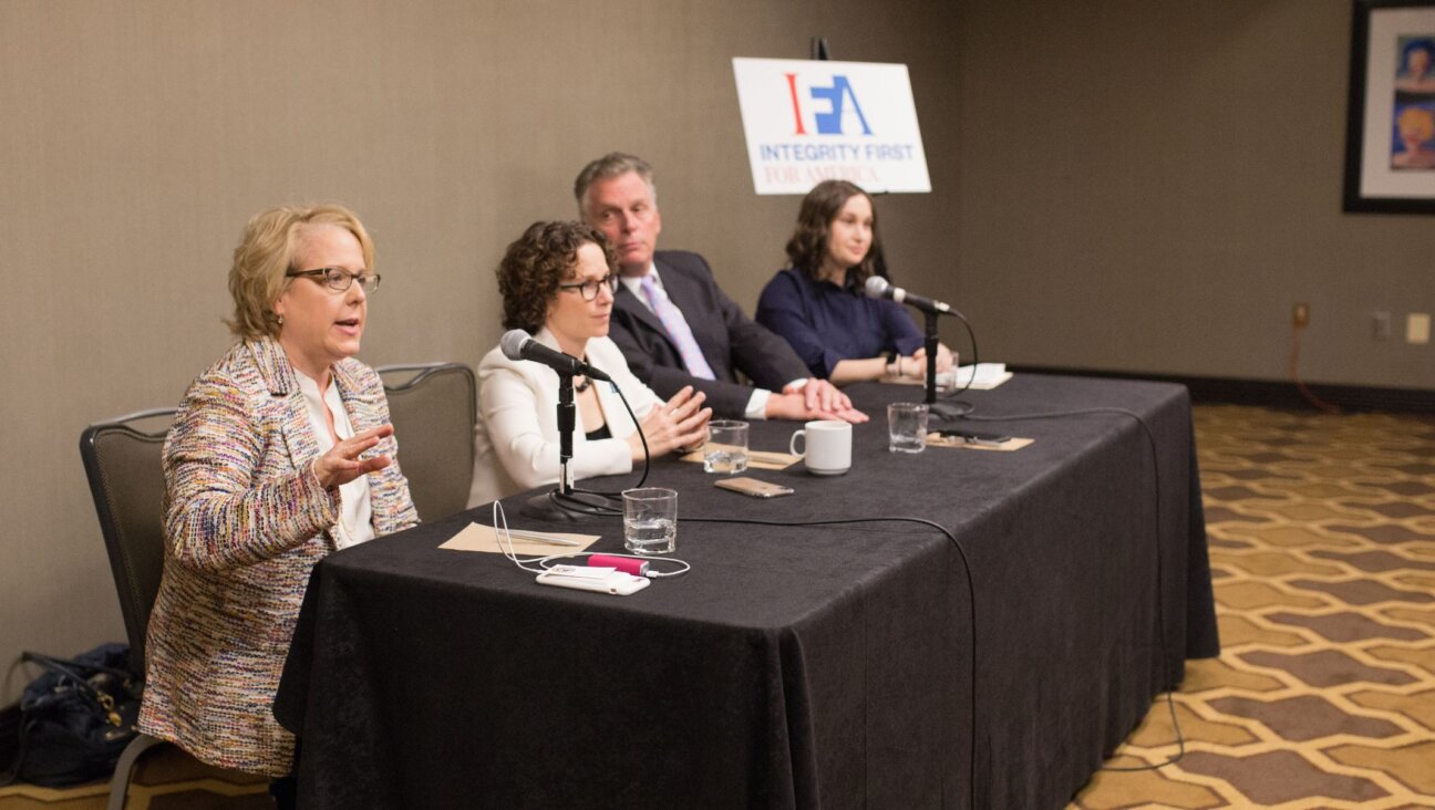 Roberta Kaplan addresses a panel in Washington D.C. about the case her organization, Integrity First for America, is bringing against the organizers of the neo-Nazi 2017 march in Charlottesville, Virginia. Seated left to right are Kaplan, her co-counsel, Karen Dunn, former Virginia Gov. Terry McAuliffe, and IFA executive director, Amy Spitalnick. (IFA/Emily Goodstein)