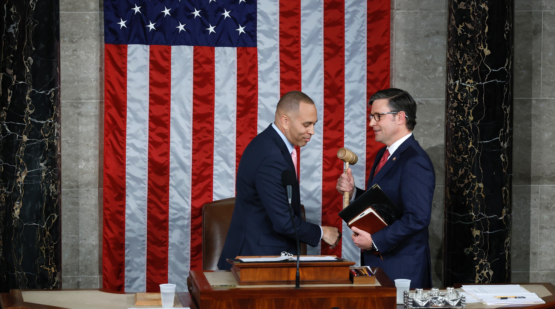 U.S. House Minority Leader Hakeem Jeffries, a New York Democrat, on the left, hands the gavel to newly elected Speaker of the House Mike Johnson, a Louisiana Republican, after the House of Representatives held an election in the U.S. Capitol, Oct. 25, 2023. (Chip Somodevilla/Getty Images)