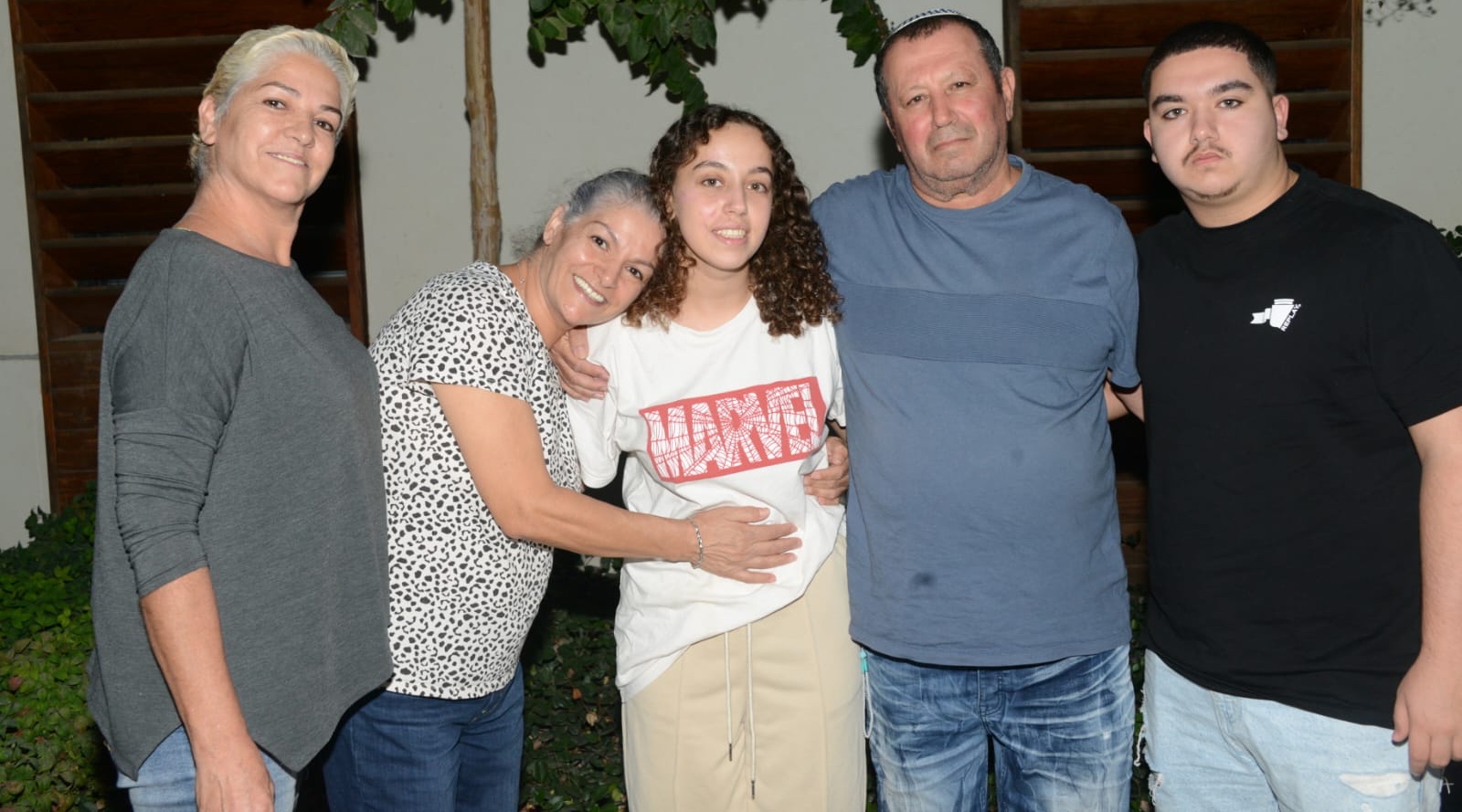 Ori Megidish, center, poses with her family after her rescue from the Gaza Strip, Oct. 30, 2023. (Israel Security Agency)