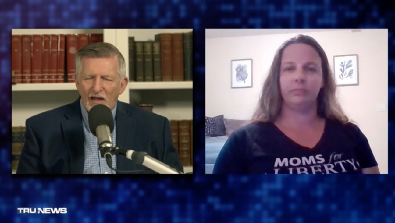 Moms For Liberty local chair Jen Pippen (right) appeared on an episode of “TruNews,” hosted by the antisemitic conspiracy theorist Rick Wiles (left), months after successfully pushing her school to ban a graphic adaptation of Anne Frank’s diary, September 2023. (Screenshot via Rumble)