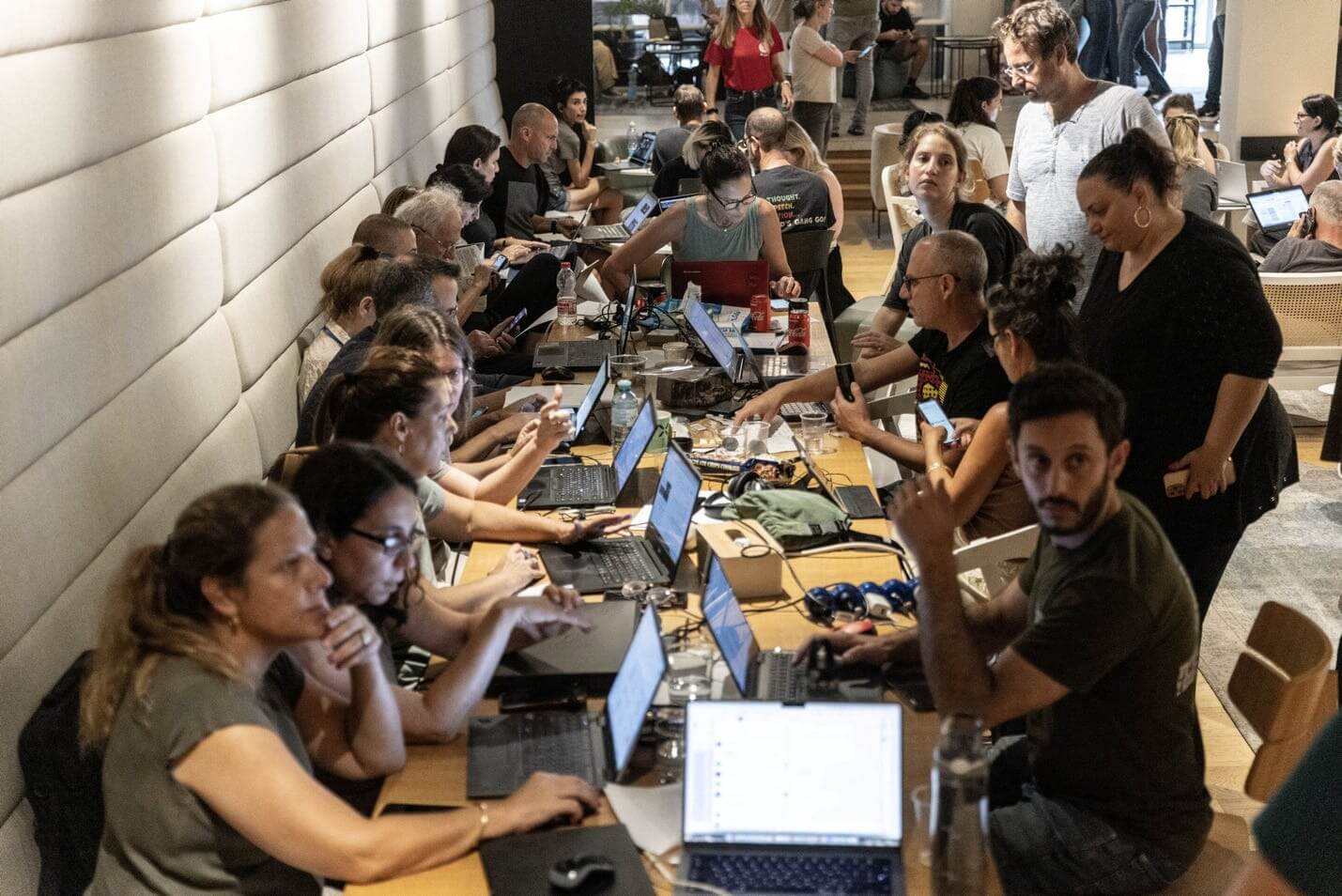 Israeli volunteers work to collect and distribute donations and food for citizens in the country's south at an emergency center in Tel Aviv, October 2023.