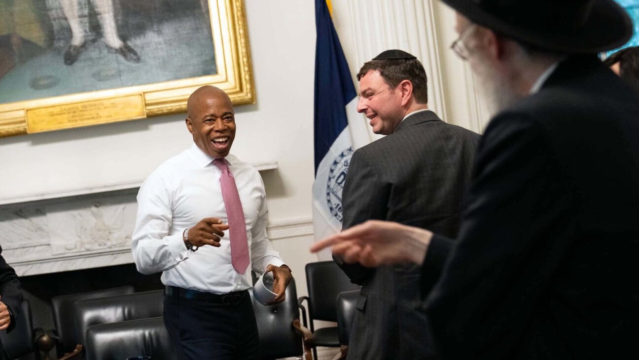 NYC Mayor Eric Adams with a Yiddish-speaking reporter during an ethnic media roundtable on Sept. 19, 2022.