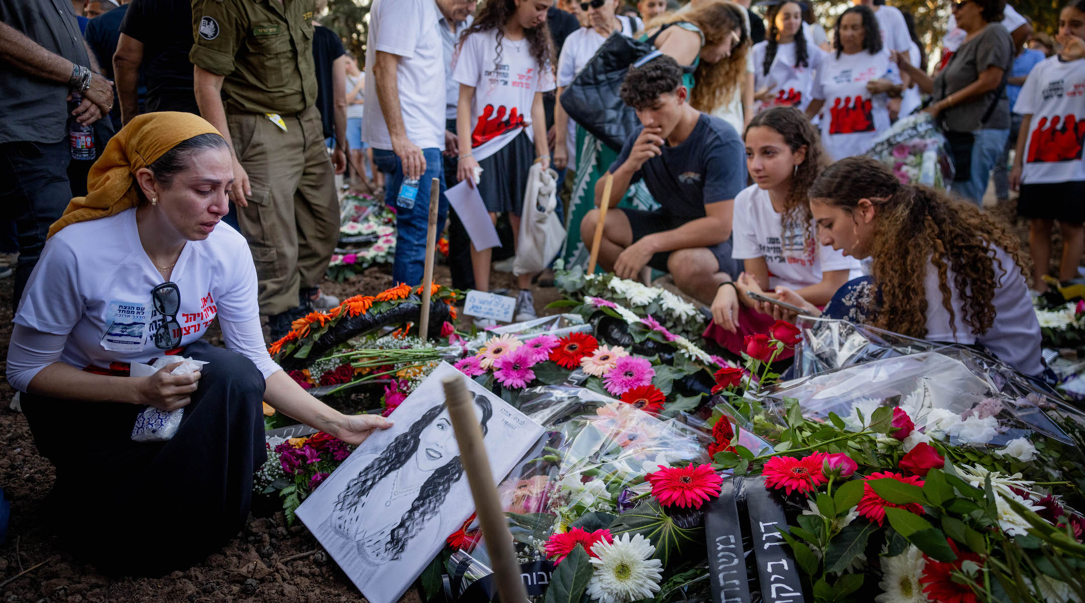 Family and friends attend the Oct. 25 funeral of three members of the Sharabi family, Lian, Noya and Yahel, who were murdered by Hamas terrorists in Kibbutz Be’eri on October 7, 2023. (Chaim Goldberg/Flash90)