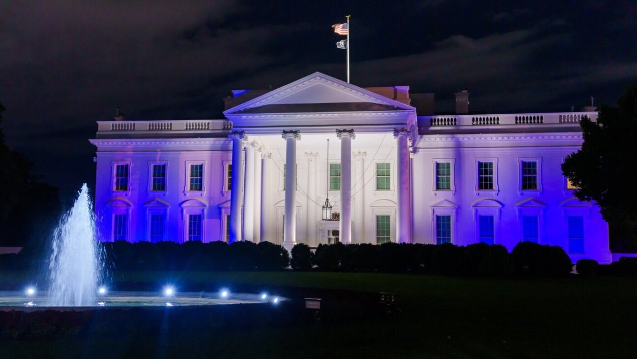 The White House draped in white and blue in honor of Israel on Oct. 9, 2023.