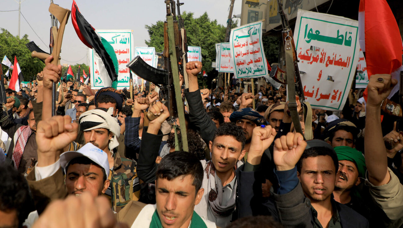 People brandishing weapons take to the streets of Yemen's Huthi-held capital Sanaa on Saturday in support of the Palestinians, after the militant group Hamas launched a surprise large-scale attack against Israel from Gaza.