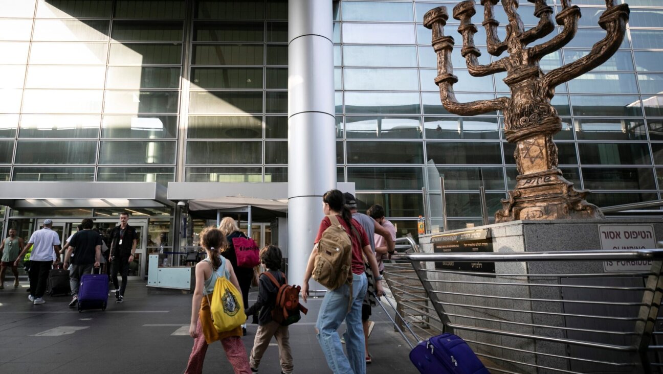 Travelers are seen at Ben Gurion International Airport near Tel Aviv, Israel, Oct. 8, 2023. International airlines delayed or cancelled their flights to and from Israel after an attack by Hamas triggered a war (Chen Junqing/Xinhua via Getty Images)