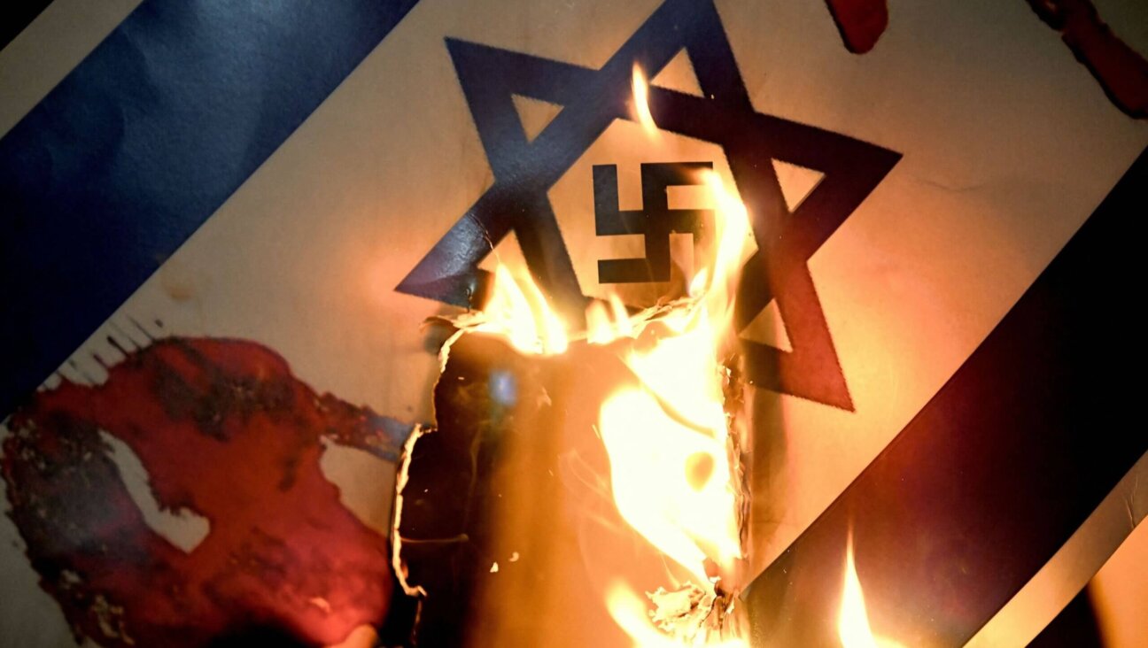 Protesters burned a placard representing an Israeli flag with a Nazi swastika inside the Star of David during a rally in support of Palestinians outside the Israeli Consulate in Istanbul earlier this month. 