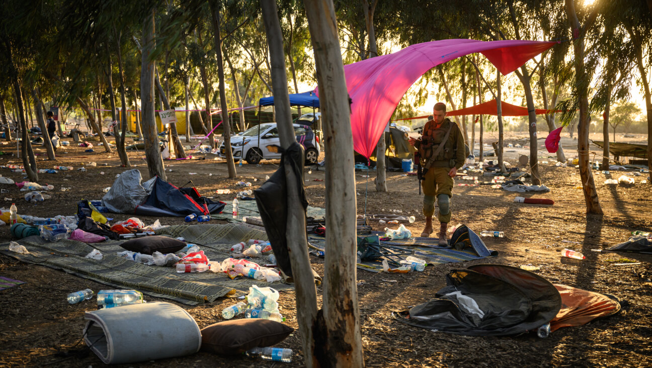 Members of the security forces continue to search for identification and personal effects at the Supernova Music Festival site, where hundreds were killed and dozens taken by Hamas militants near the border with Gaza. Oct. 12, 2023 in Kibbutz Re'im, Israel.