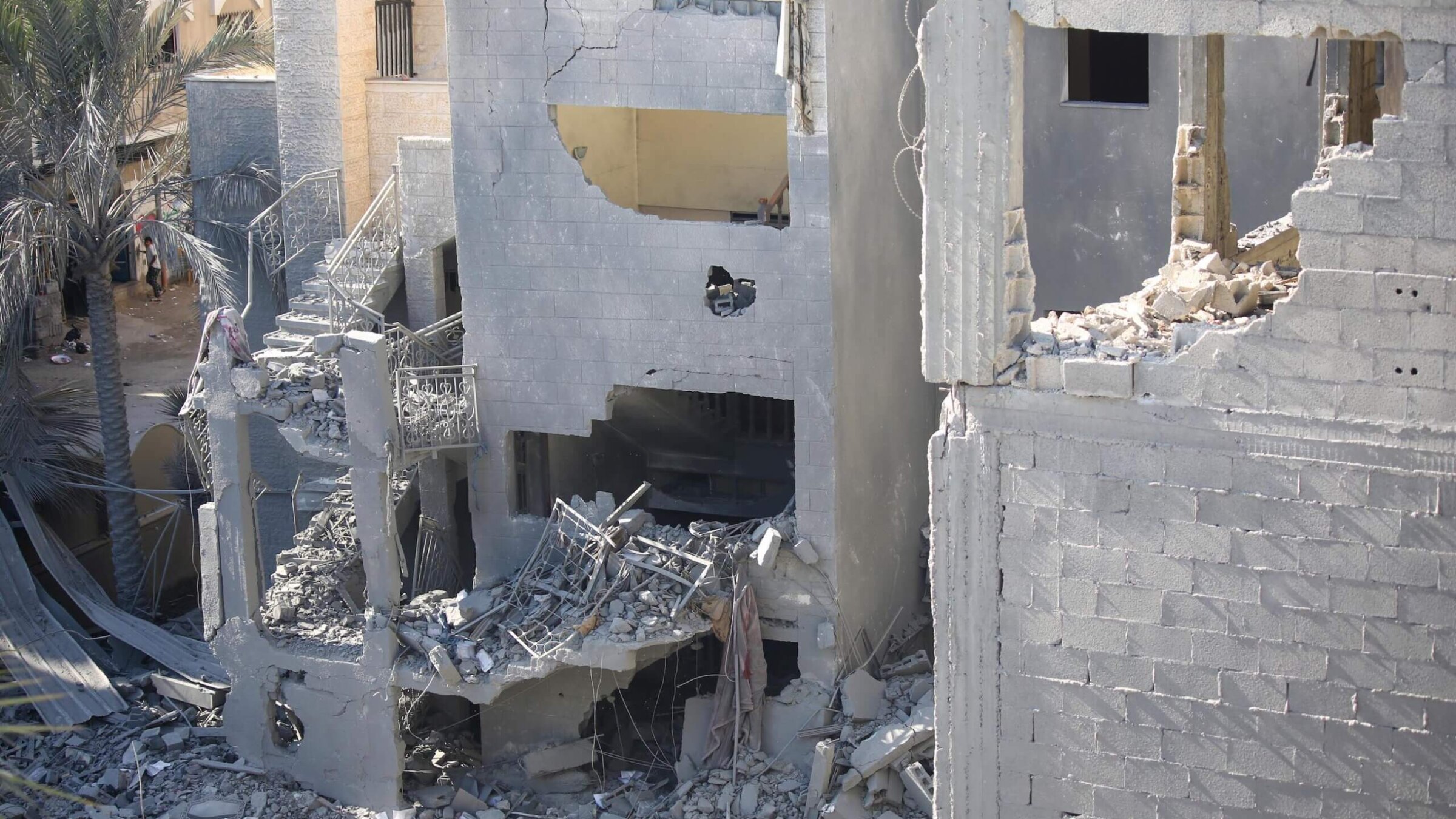 Buildings destroyed during Israeli air raids in the southern Gaza Strip. Ahmed Fouad Alkhatib's family did not receive warning before an airstrike hit their home last week.