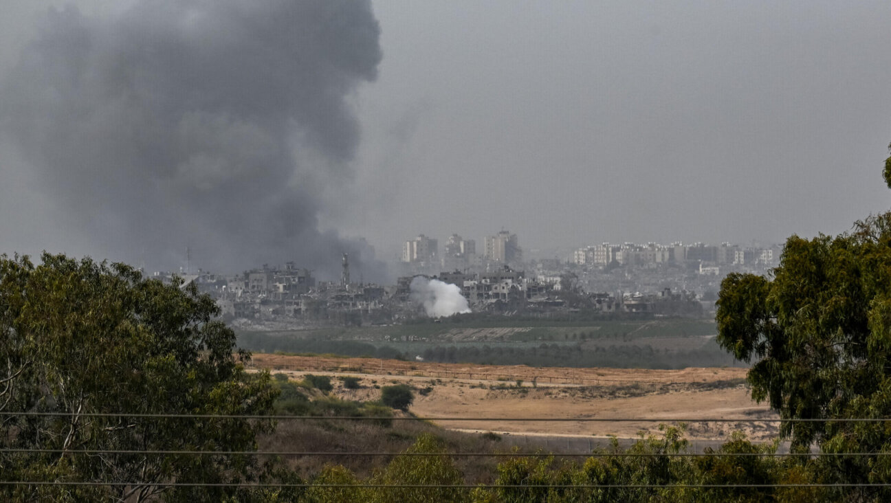 An incoming Israeli military strike on buildings in Gaza City Sunday. 