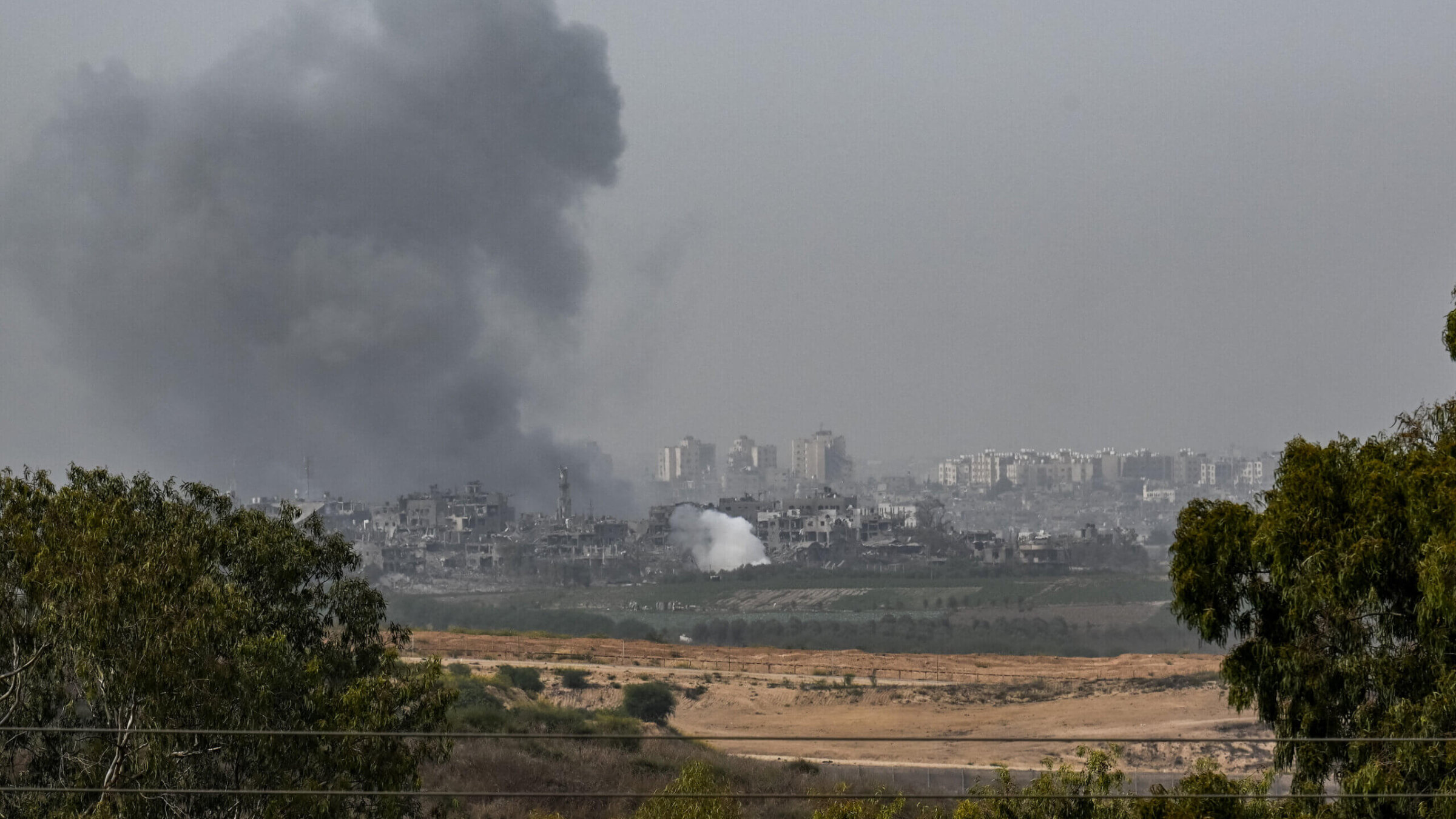 An incoming Israeli military strike on buildings in Gaza City Sunday. 