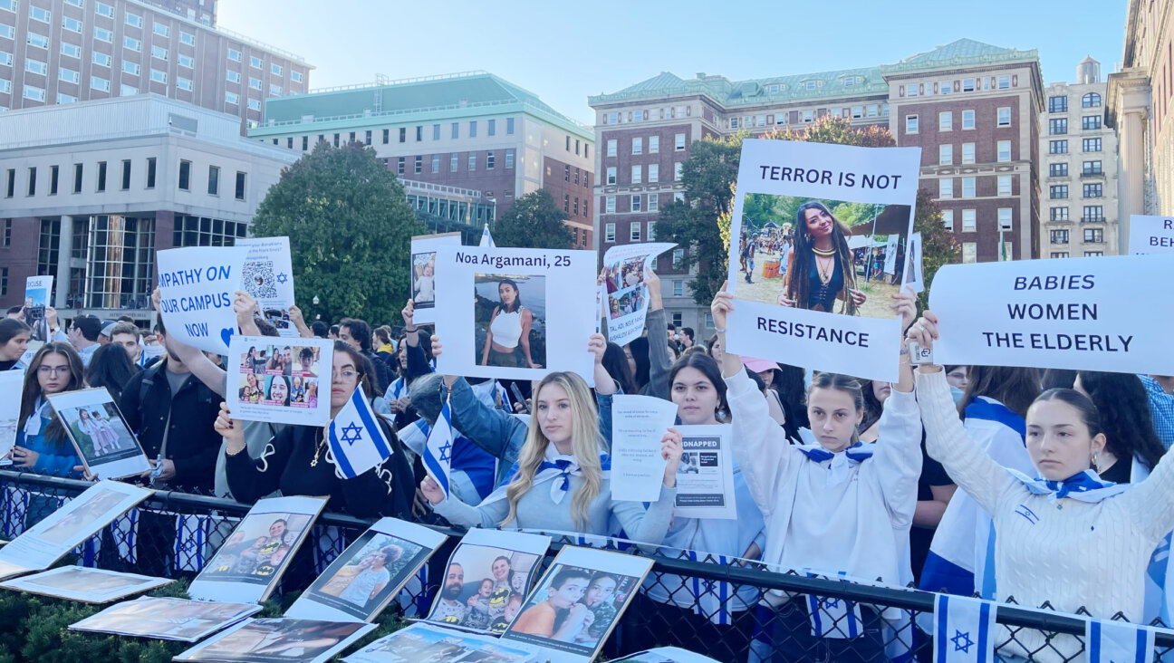 Students at a pro-Israel protest at Columbia University on Thursday, Oct. 12, hold up photos of Israelis kidnapped by Hamas.