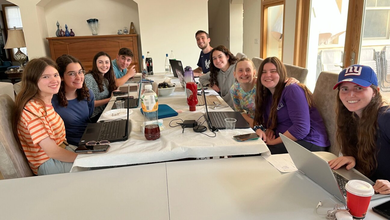 Yigal Marcus' dining room in Hashmonaim, Israel, has been converted to a command center for processing volunteer forms.