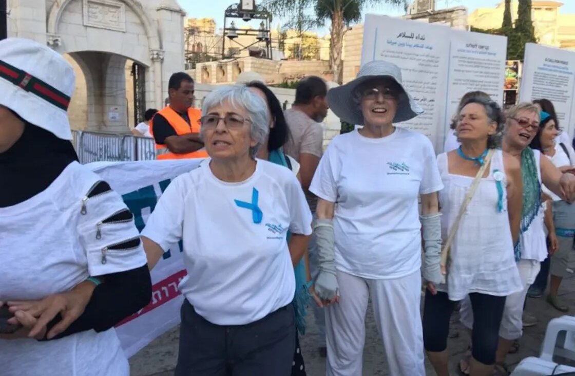 Vivian Silver, center left, marches in a demonstration with Women Wage Peace, an organization that she co-founded that centers women in Israel-Palestinian peacemaking.