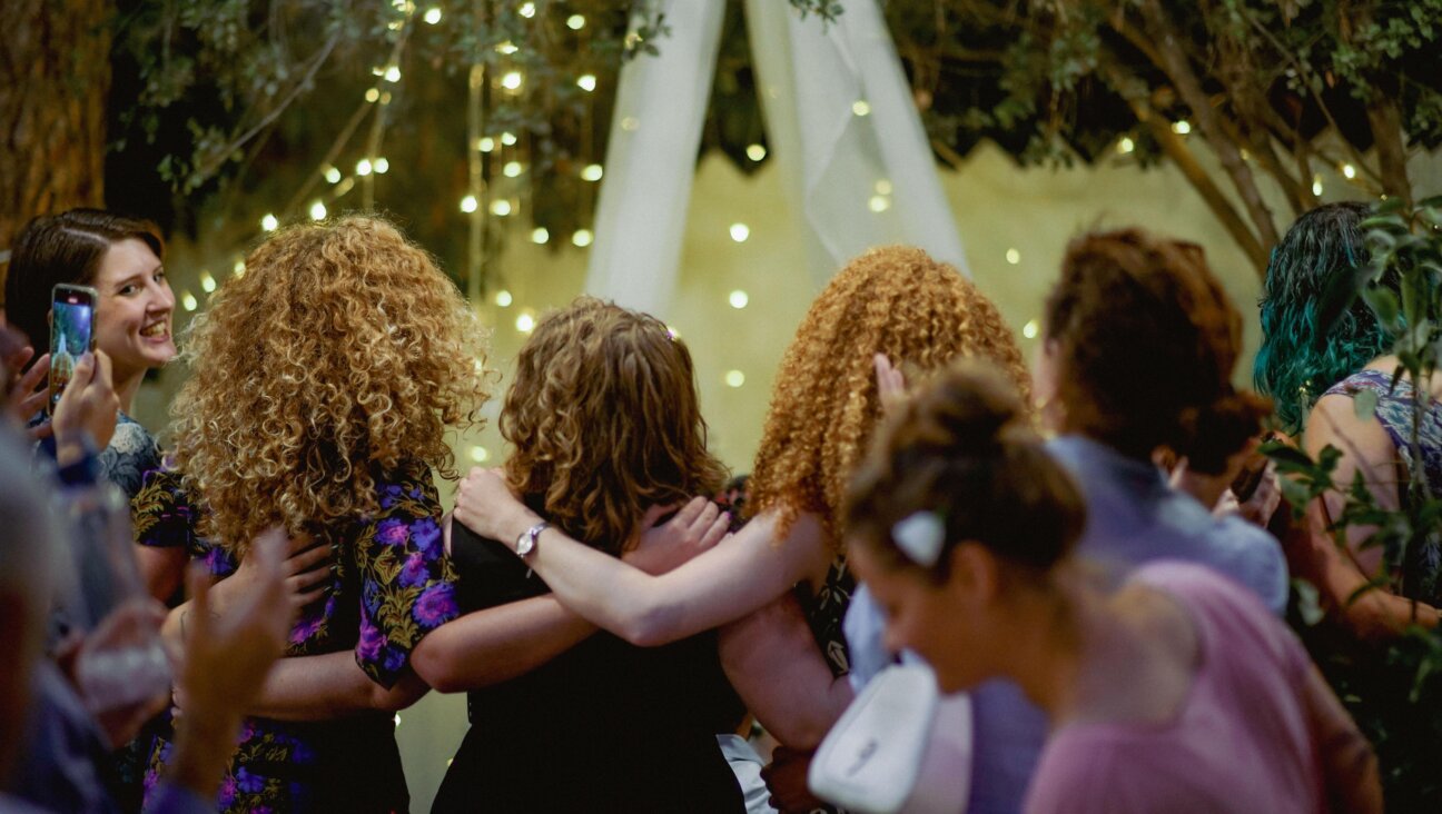 Planned for a large hall that could fit 400, the wedding took place in a small community garden.