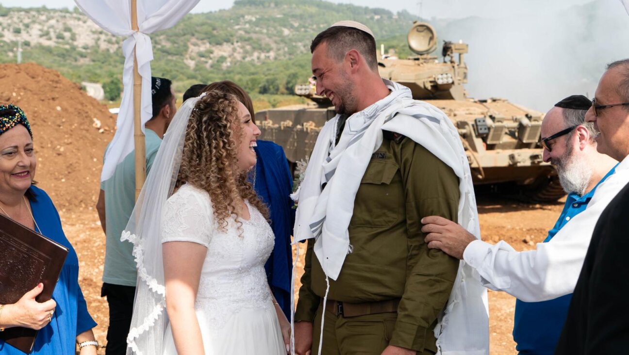 Shirel Tayeb and Reuven Lebetkin are married at Israel’s northern border on Oct. 23, 2023. Their planned wedding date took place during the Israel-Hamas war and they chose to move forward with changes. (Courtesy of Lebetkin)