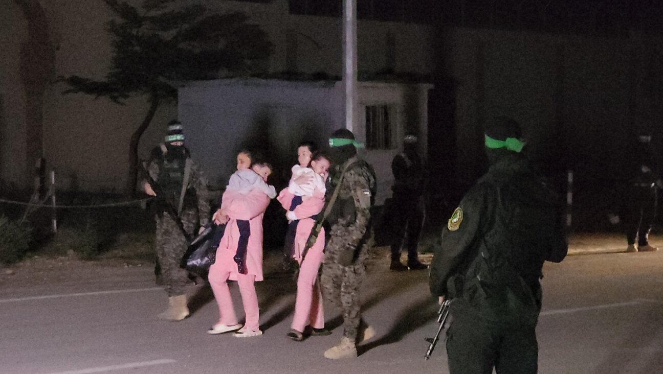 Hamas hands over 11 Israeli hostages to the International Committee of the Red Cross in Gaza City, Gaza on November 27, 2023. (Stringer/Anadolu via Getty Images)