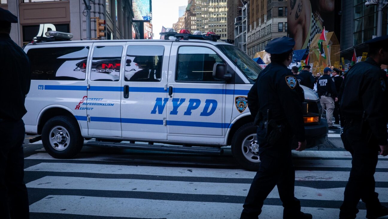 Police separate Israel supporters and pro-Palestinian demonstrators in Times Square, New York City, October 13, 2023. (Luke Tress)