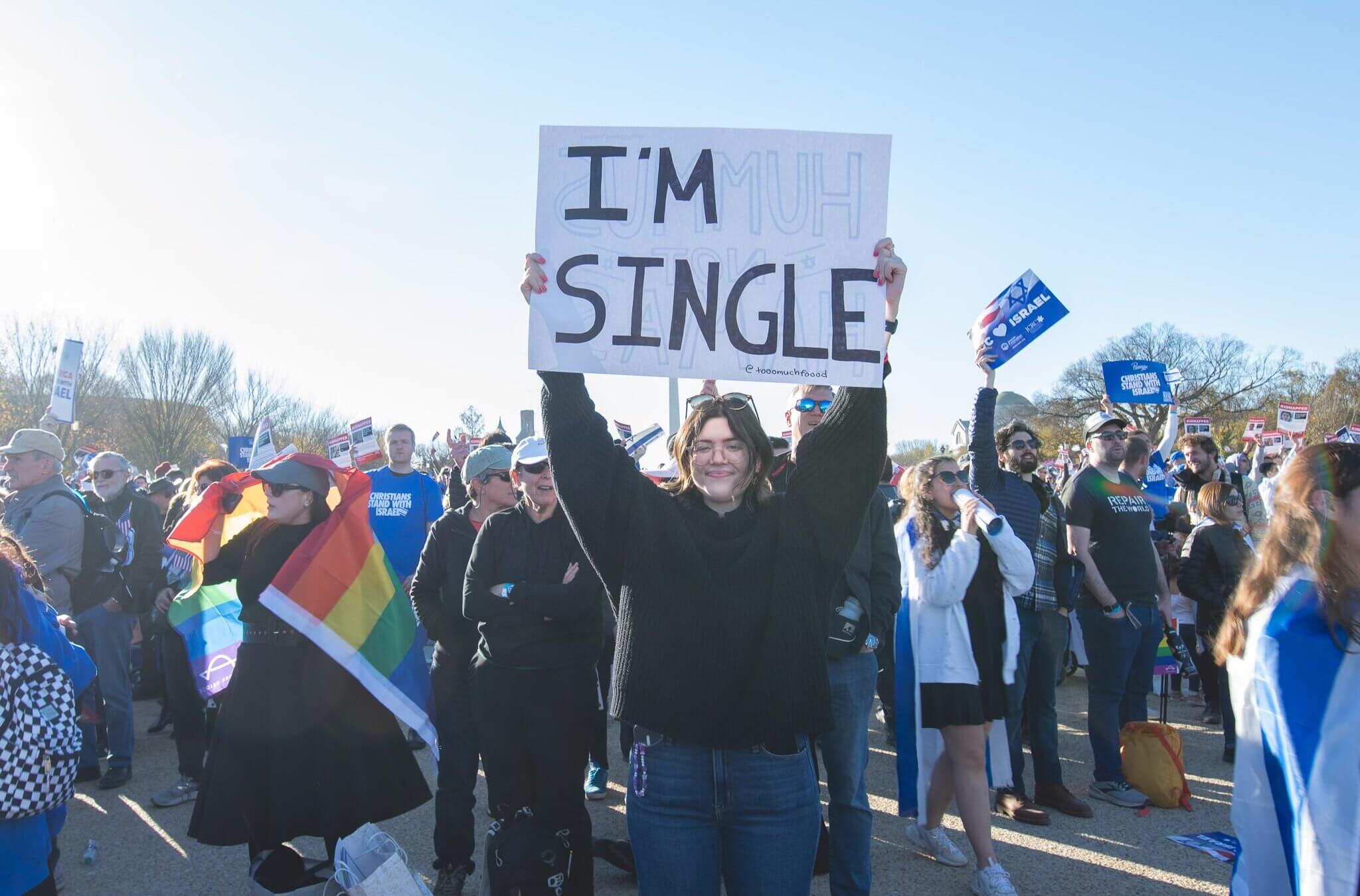 Morgan Raum holds up her now-famous "I'm Single" sign at the rally for Israel in the National Mall on Nov. 14.