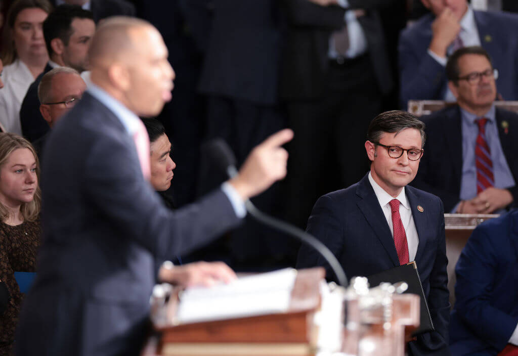 House Speaker House Mike Johnson watches as House Minority Leader Hakeem Jeffries (D-NY) delivers remarks on Oct. 25, 2023.