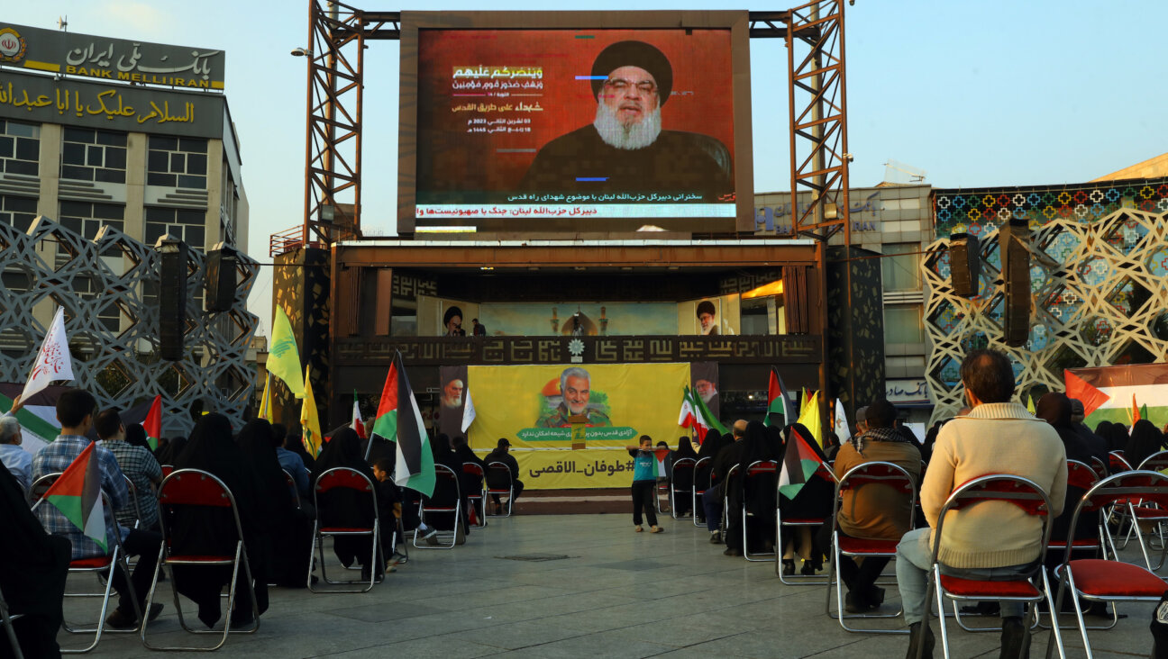 People listen to a speech by Hezbollah leader Hassan Nasrallah on November 3, 2023 in Tehran, Iran. (Majid Saeedi/Getty Images)