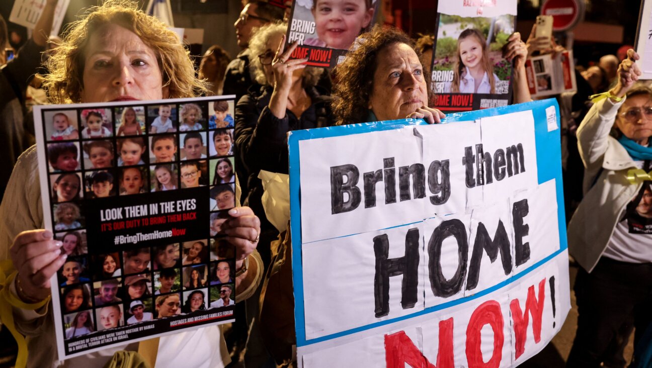 Protesters lift placards during a rally outside the Unicef offices in Tel Aviv on Nov. 20 to demand the release of Israelis held hostage in Gaza since the Oct. 7 attack by Hamas terrorists.