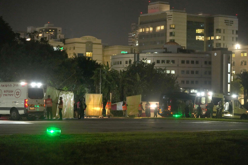 Ambulances and emergency workers wait outside Schneider medical center in Petah Tivka, Israel, where some of the released hostages are expected to be brought, on Nov. 24. A total of 50 hostages currently held by Hamas are to be released during a four-day truce with Israel, the first such pause in fighting since Oct. 7.