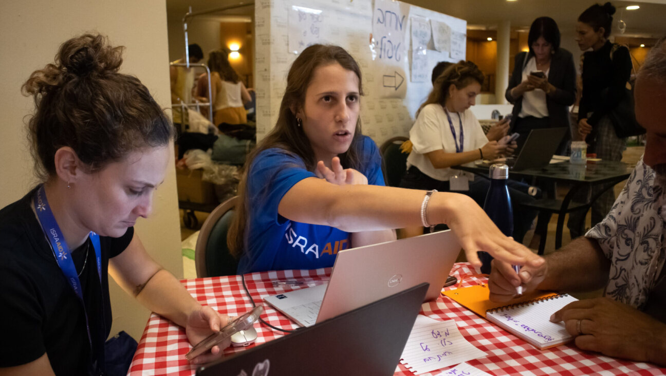 Volunteers with IsraAID, an Israeli international aid group, staff an effort to support Israelis internally displaced after Oct. 7. (Courtesy IsraAID)