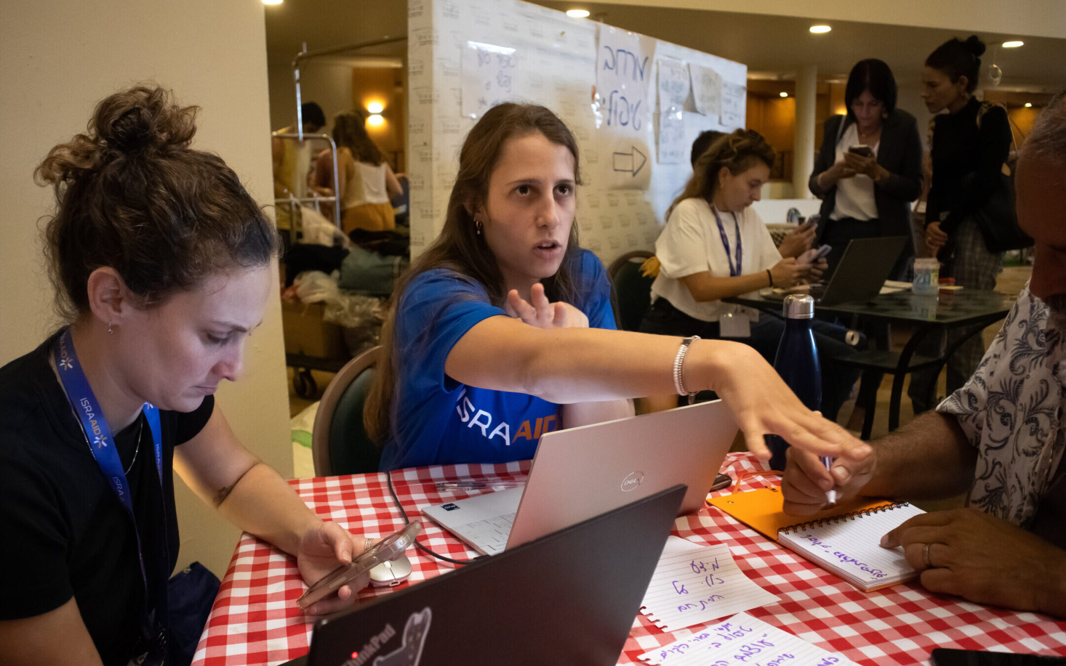 Volunteers with IsraAID, an Israeli international aid group, staff an effort to support Israelis internally displaced after Oct. 7. (Courtesy IsraAID)