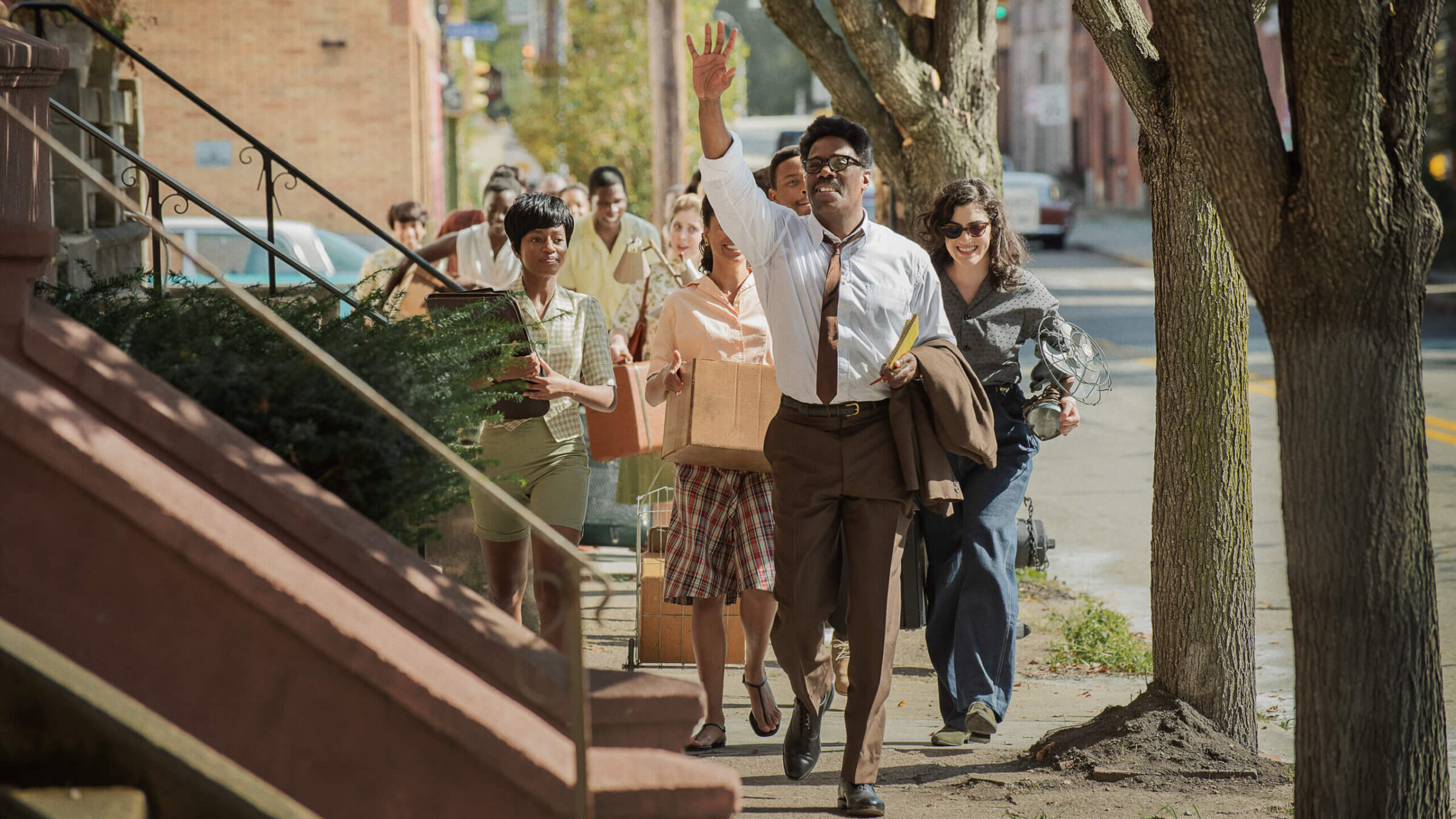 Colman Domingo (center) as Bayard Rustin, leads a group of his young protégés down a Harlem Street in planning for the 1963 March On Washington. 