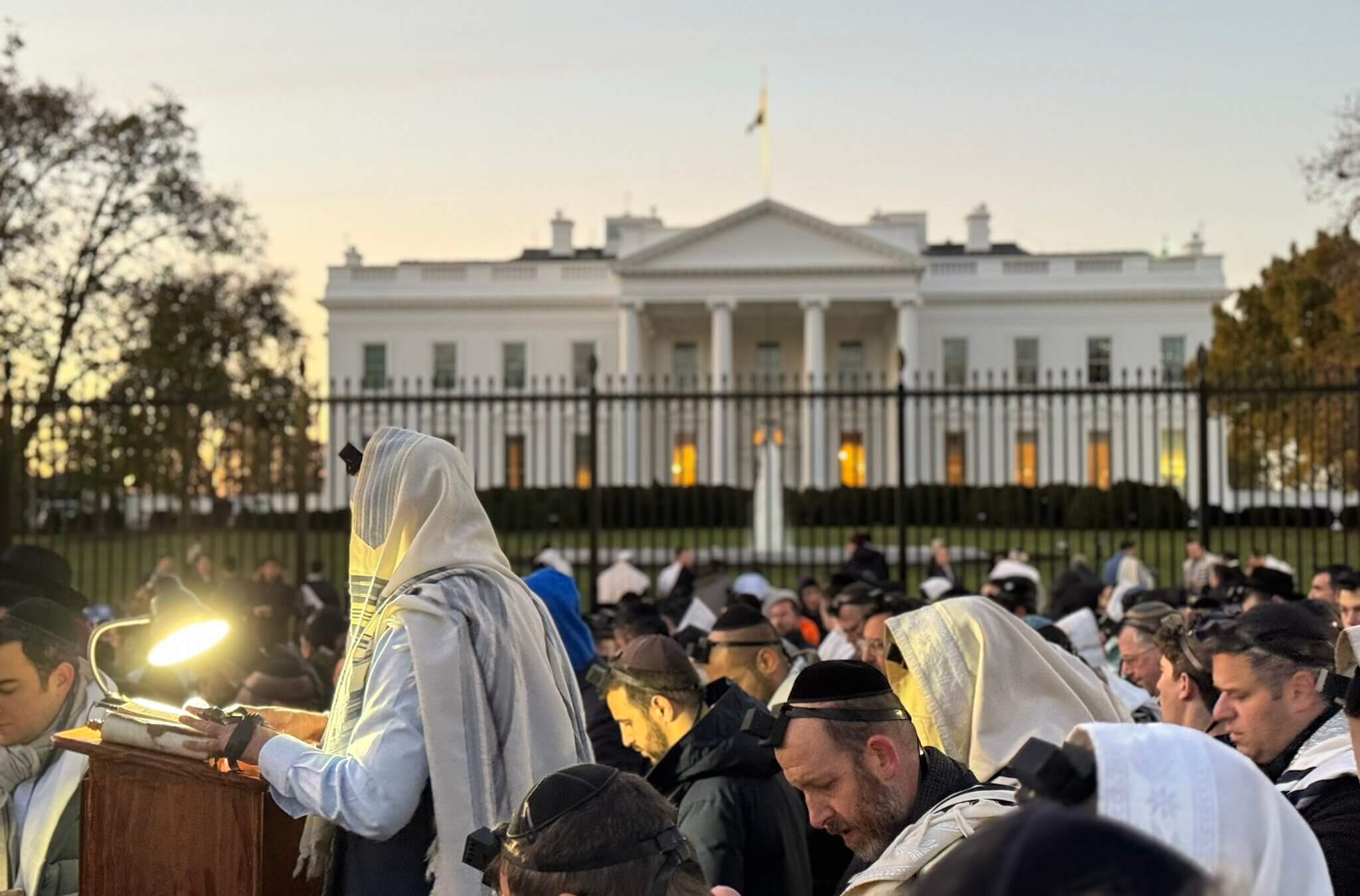 Jews pray in front of the White House as crowds arrive for the March for Israel, Nov. 14, 2023.