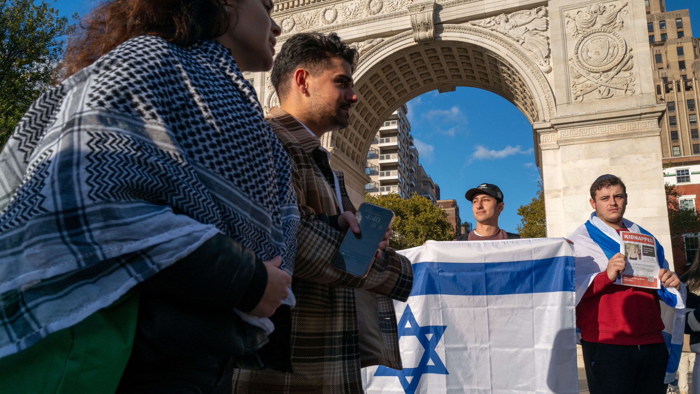 Supporters of both Palestine and Israel face off in dueling protests at Washington Square Park on October 17, 2023 in New York City. 