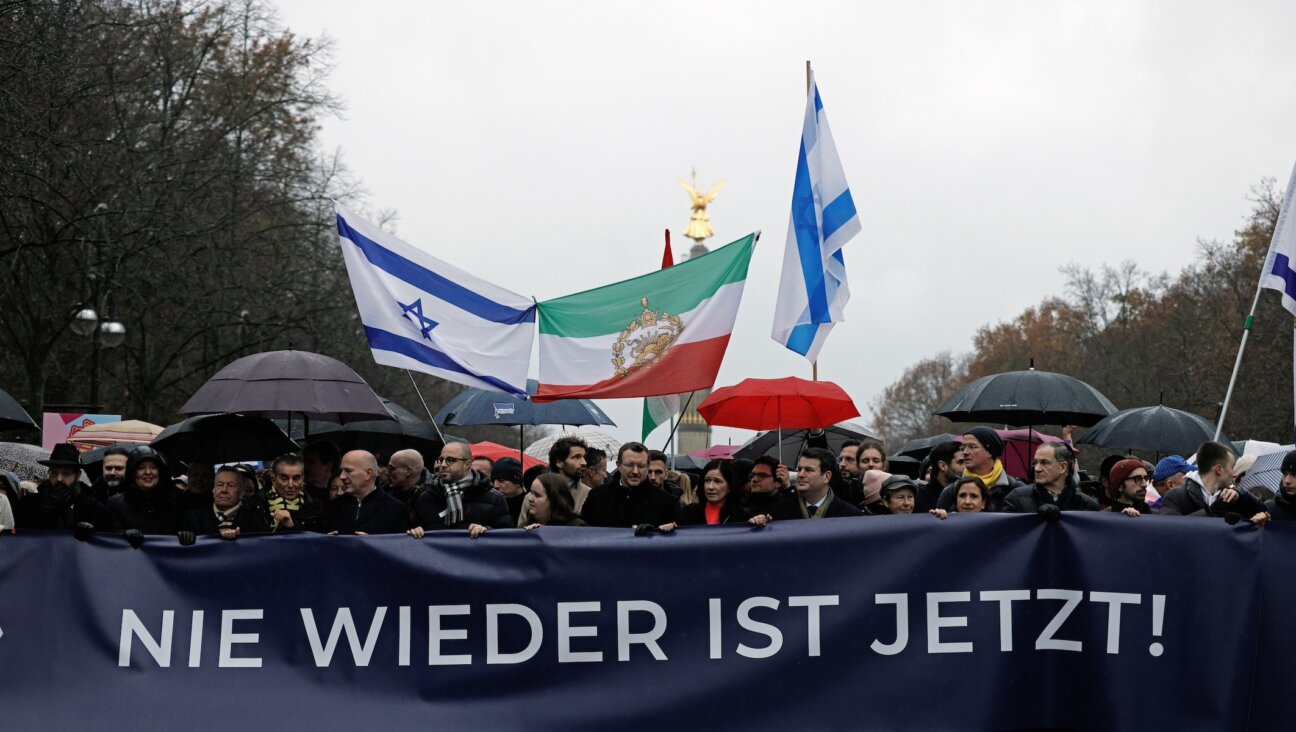 A banner reads “Never again is now!” at a pro-Israel rally in Berlin, Dec. 10, 2023. (Carsten Koall/picture alliance via Getty Images)