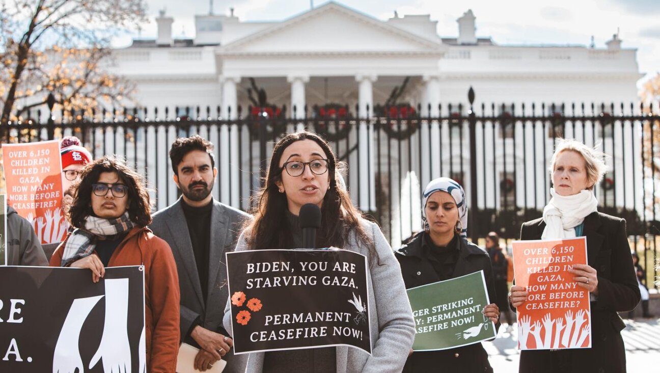 Iman Abid-Thompson, advocacy director for the US Campaign for Palestinian Rights, speaks at a rally outside the White House on Nov. 30. The group hopes to more effectively pressure elected officials to support its positions with a political arm that will be able to endorse candidates and support their campaigns.