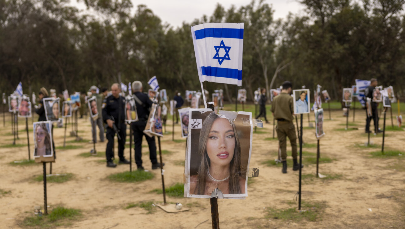 A display of photos of people killed during the Hamas attack at the Nova festival site in Re'im, Israel.