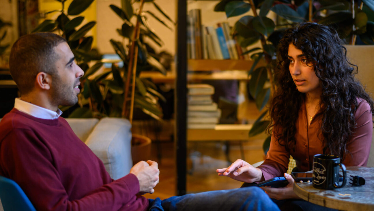 Ibrahim Abu Ahmad (L), 31 years old, from Nazareth, and Amira Mohammed (R), 24 years old, from East Jerusalem, speak about their podcast ‘Unapologetic: The Third Narrative’ on the day the sixth episode is released on December 21, 2023 in Tel Aviv, Israel.  