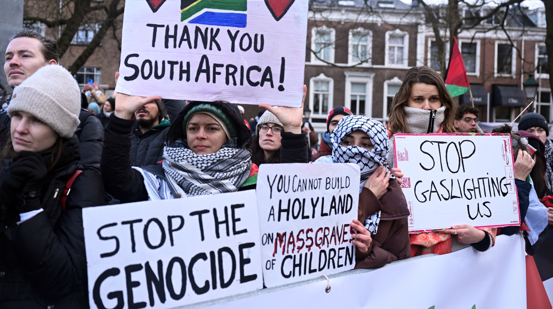 Pro-Palestinian supporters gather in front of the International Court of Justice building to demonstrate with Palestinian flags and banners during the hearing on the request for interim measures in the case filed by Israel at the ICJ on the grounds that Israel’s actions in Gaza violate the Genocide Convention in The Hague, Netherlands, Jan. 12, 2024. (Dursun Aydemir/Anadolu via Getty Images)