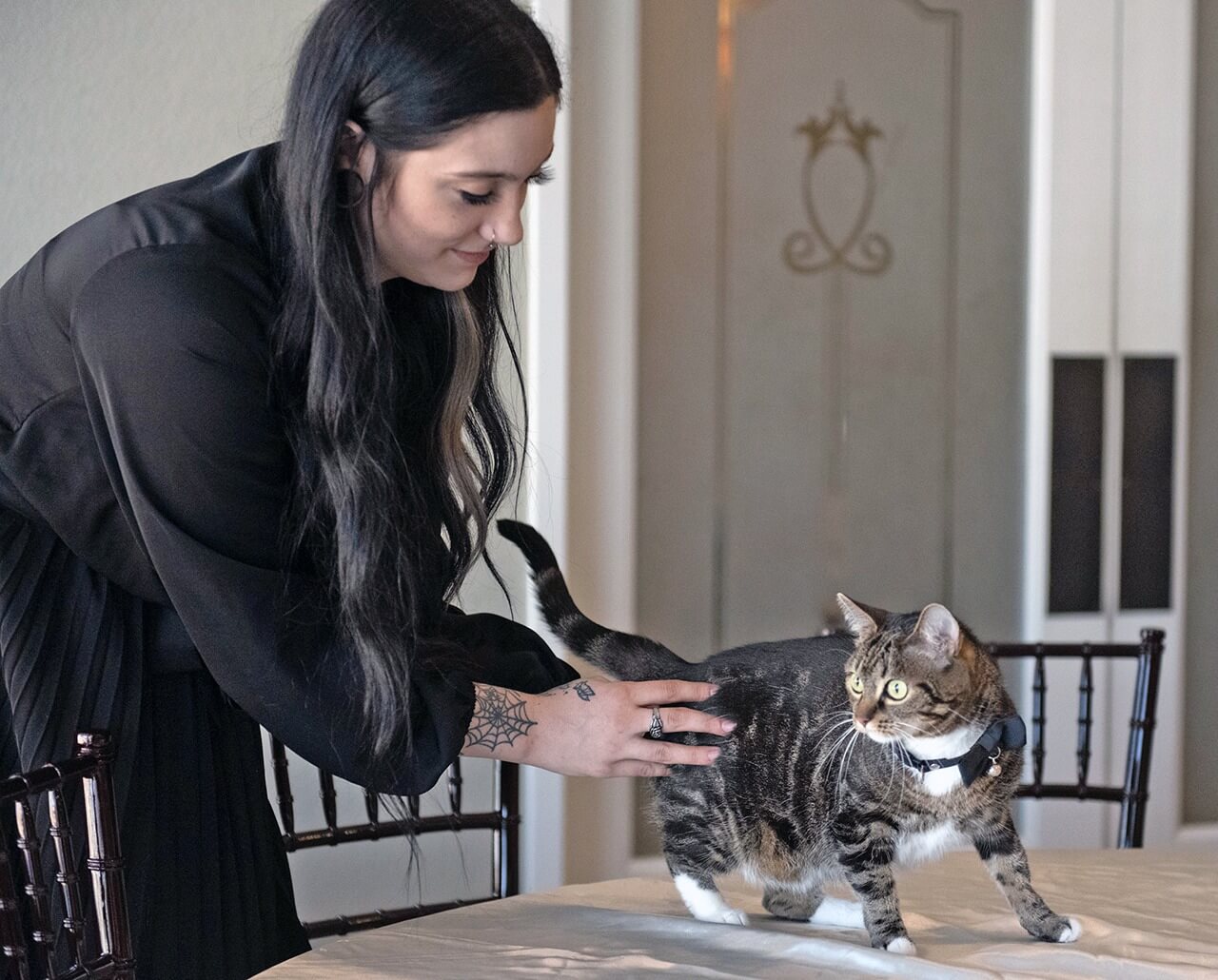 Angelique McQueen pets Lana at Lombard Funeral Home in Sacramento.