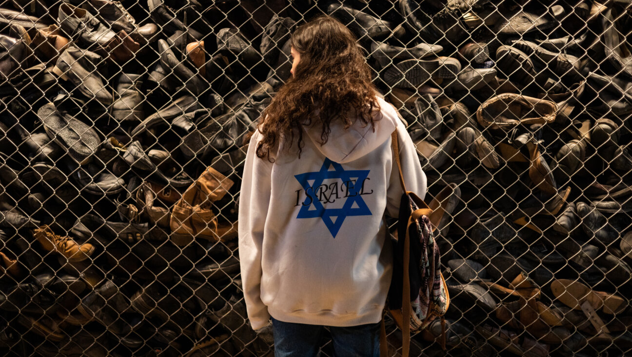 Naomi Harari as Nitzan, who takes a shoe from the pile at Majdanek. 