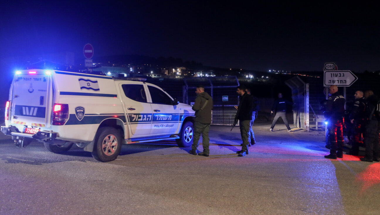 Police and security personnel near the scene of a car-ramming in the West Bank on January 7, 2024. (Jamal Awad/Flash90)