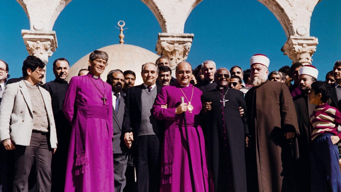 South African activist and Nobel laureate Desmond Tutu (third from right) poses with members of clergy and Palestinian leaders Faisal Husseini and Radwan Abu Ayash on December 23, 1989 during his visit in Jerusalem. 