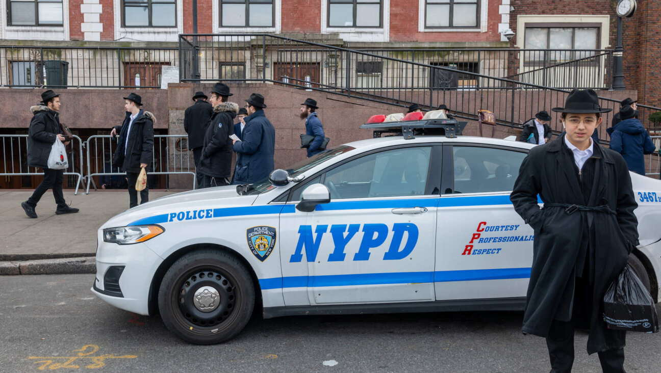 Hasidic men and boys gather outside of the Chabad-Lubavitch global headquarters in Crown Heights, Brooklyn.