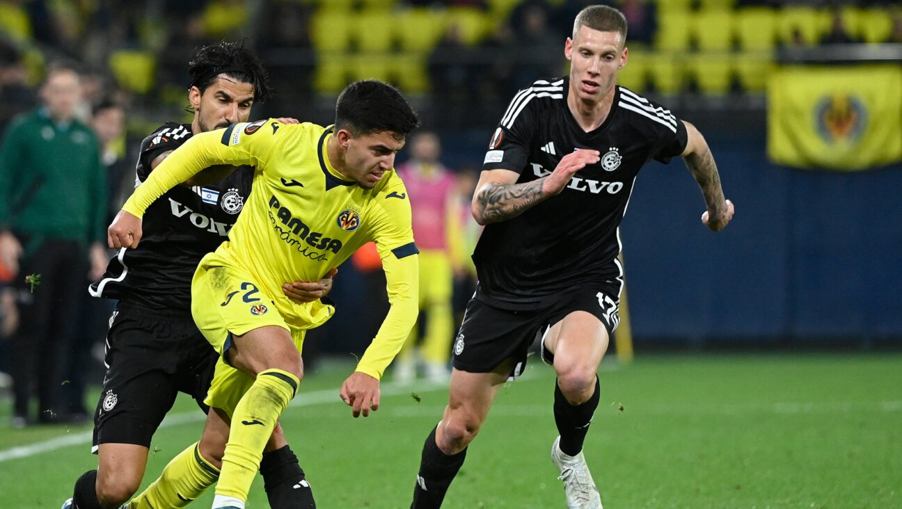 A match between Maccabi Haifa (in black jerseys) and Villarreal CF during the UEFA Europa League first round, Dec. 6, 2023, in Vila-real, Spain. (Jose Jordan/AFP via Getty Images)